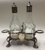 A rare 18th Century silver mounted and glass oil and vinegar set. London 1761. By RP. Approx. 455