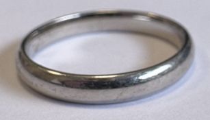 A plain platinum wedding band.