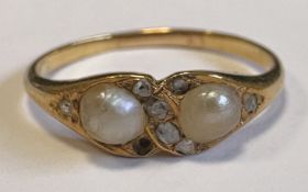 A pearl and rose diamond ring in 15 carat gold mount.