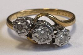 An 18 carat gold diamond crossover ring.