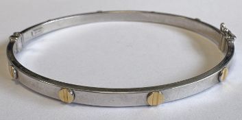 A 9 carat white gold bangle.