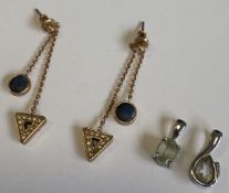 Two gold-set pendants in claw mounts etc.