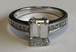 A good single-stone emerald-cut diamond ring.