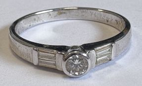 A small diamond single-stone ring.