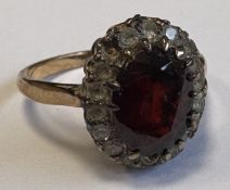 A 9 carat garnet-set cluster ring.