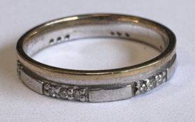 A 9 carat two-colour gold diamond-set ring.