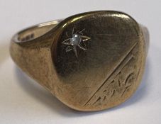 A 9 carat signet ring.