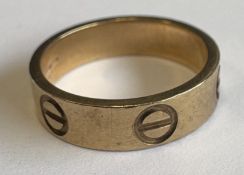 A 9 carat ring of stylised form.