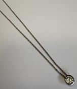 A 9 carat fine link chain together with a stone-set pendant.