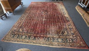An old carpet decorated in bright colours and red