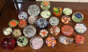 A large collection of paperweights.