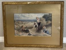 A gilt framed and glazed watercolour depicting farmhands making hay in the fields.