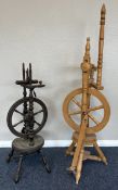 Two old spinning wheels.