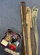 A selection of old fishing rods and reels to include Farlows and Hardys etc.