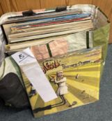 A selection of 12 inch vinyl record albums.