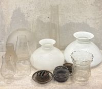 A collection of etched-glass and other lampshades.