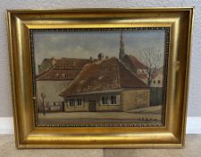 A gilt framed oil on canvas depicting a building in brown hues.