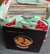 A selection of 12 inch vinyl record albums.