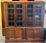 An oak and lead glazed four-door bookcase.