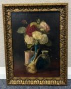 A gilt framed oil on board depicting a still life.