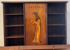 An oak wall-mounted bookcase.