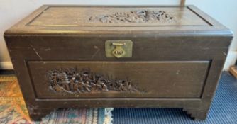 A carved Continental hardwood trunk.