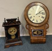 An inlaid wall clock together with one other.