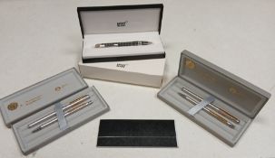 A Mont Blanc ballpoint pen in box together with others.