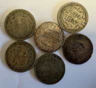 Six silver half-crown coins.