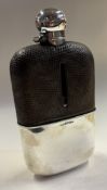 A Victorian silver and leather flask.