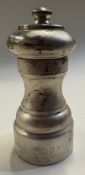 A silver pepper grinder.