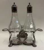 A rare 18th Century silver-mounted oil and vinegar cruet.