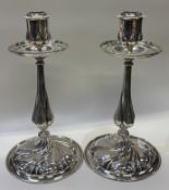 A fine pair of Victorian silver candlesticks.