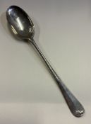 A Queen Anne silver rat tail hash spoon.