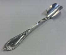 A solid silver cheese scoop.