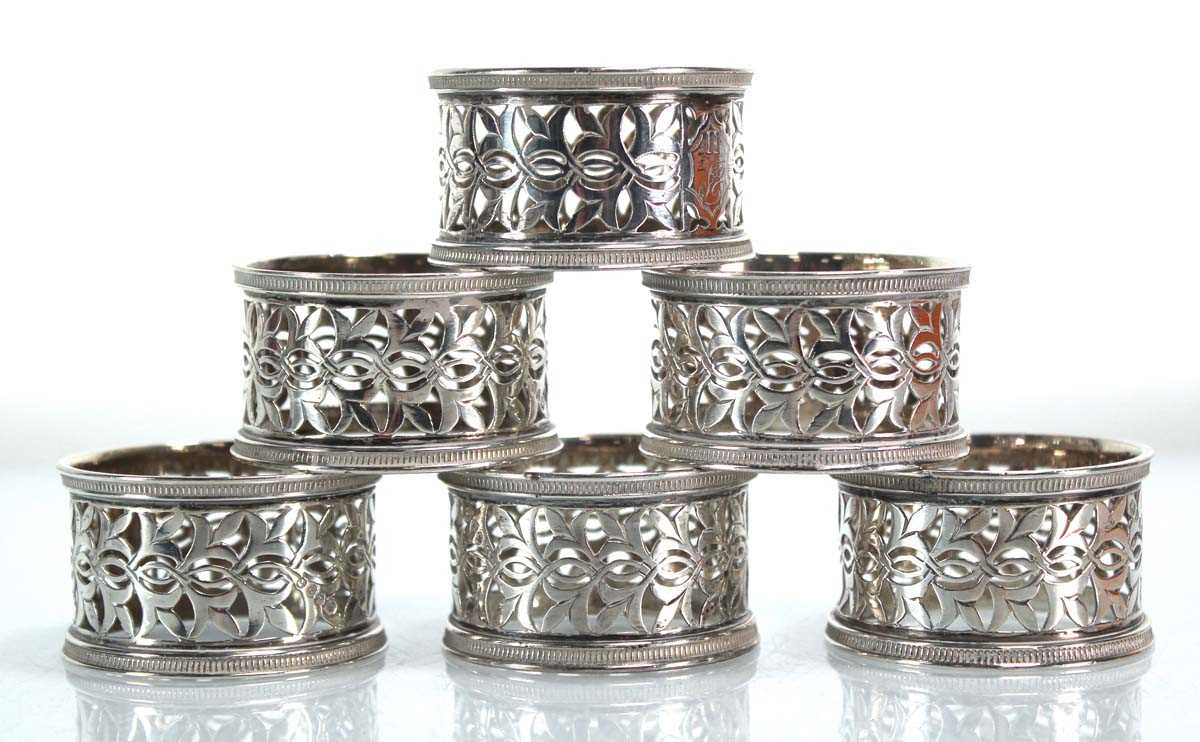 A set of six silver Victorian pierced silver napkin rings, maker RH ...