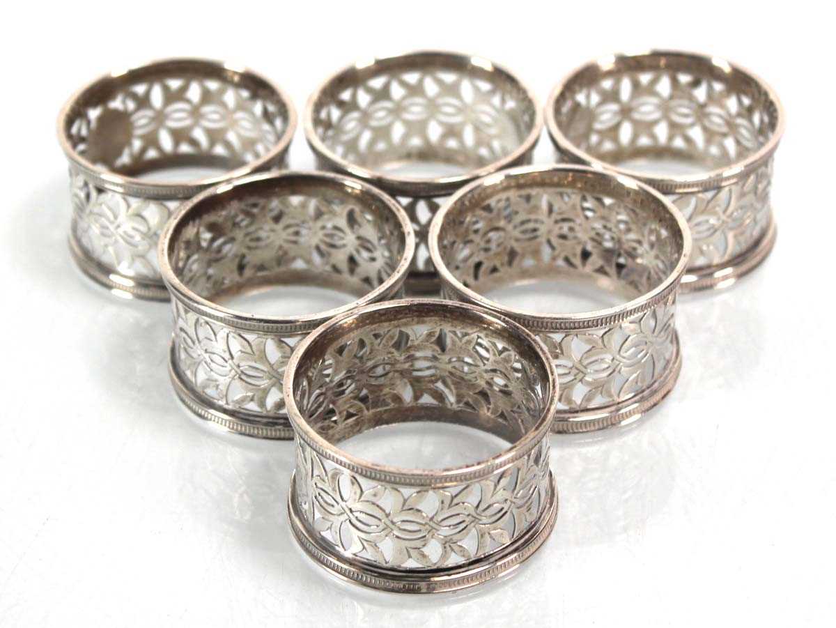 A set of six silver Victorian pierced silver napkin rings, maker RH ...