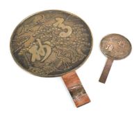 A Chinese Export polished brass hand mirror with relief detail to the reverse and bamboo grip, di.