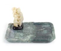A jadeite figural group modelled as a mother and child, with a hardwood plinth, together with a