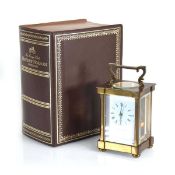 A Matthew Norman of London carriage timepiece contained within a brass and five-glass case of