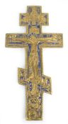 A late 19th/early 20th century Russian Orthodox brass and enamelled crucifix bearing Old Cyrillic