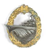 A Second World War Kriegsmarine Destroyer cap badge, gilt finish, marked 'S.H.u.Co.'