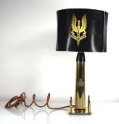 A brass finish table lamp bearing the insignia of the 8th Irish Battalion The King's Regiment, h.