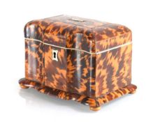 A George III tortoise-shell tea caddy with a serpentine front, on four bun feet, the interior with a