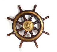 An early 20th century walnut and brass mounted ship's wheel, di. 61 cm