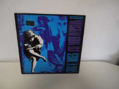 Collection of vinyl albums incl. Iron Maiden, Alice Cooper, Guns N' Roses, AC/DC and Status Quo 7"