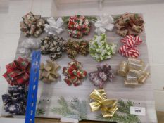+VAT Approx. 17 large Christmas themed gift bows on stand
