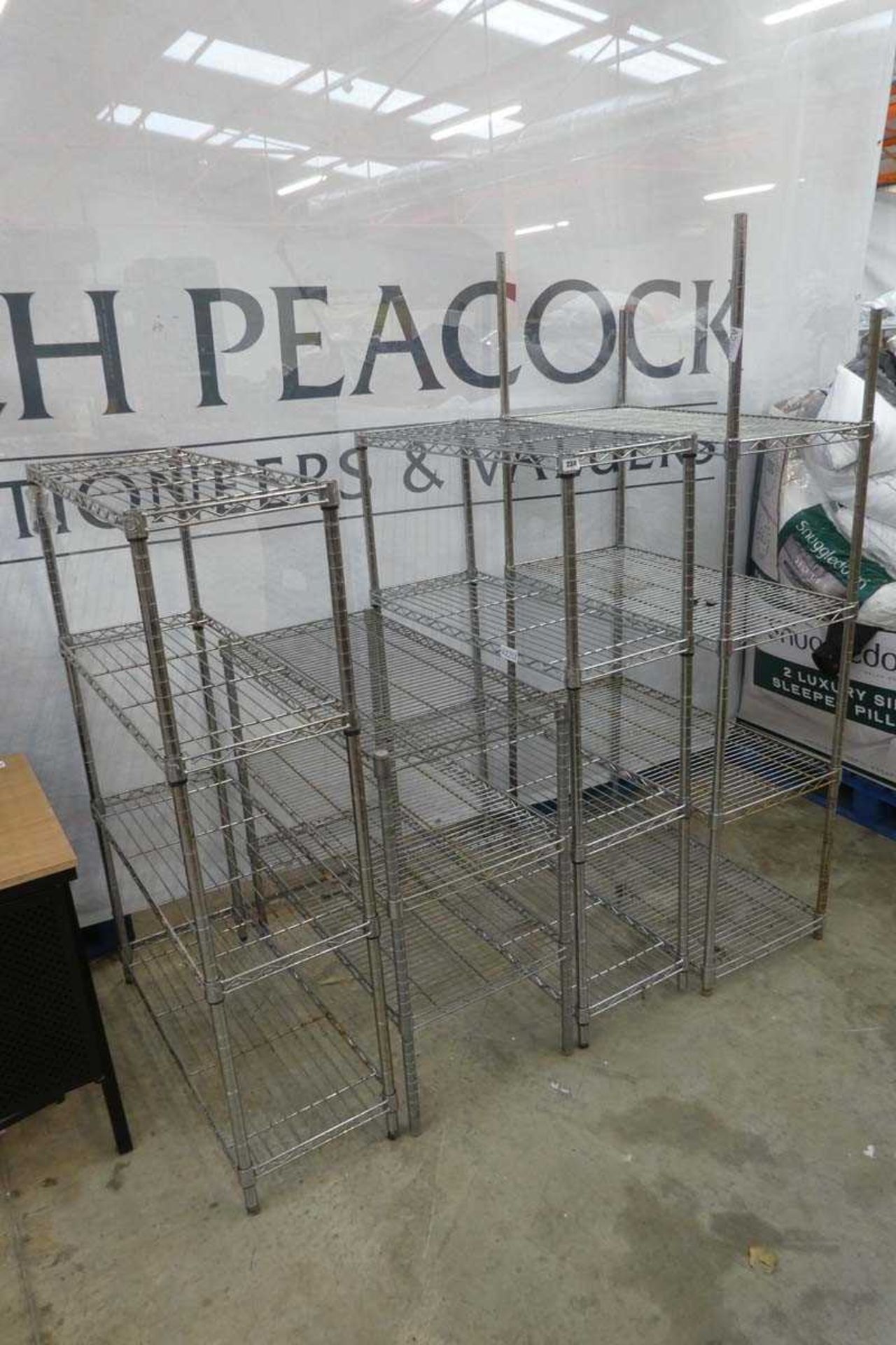 4 various sized chrome storage racks