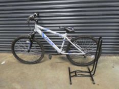 Apollo Phase mountain bike with bike stand