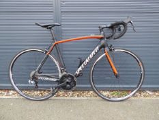 Specialised tarmac black and orange carbon fibre high spec racing bike